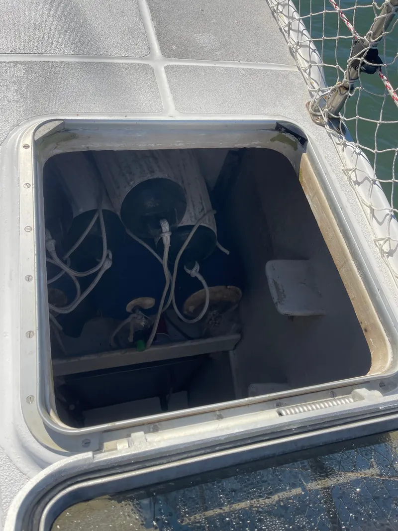 Slide: The Image of An open hatch on a boat with visible cables and equipment inside. - 20