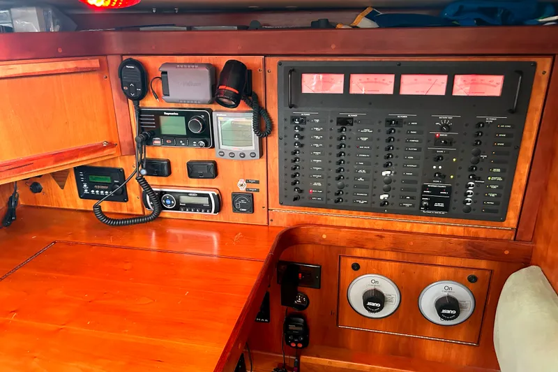 Slide: The Image of Control panel of a 2001 Sabre 402 yacht with navigation and communication equipment. - 16