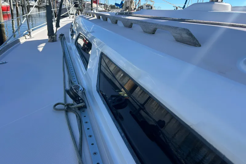 Slide: The Image of Sleek deck of a 2001 Sabre 402 sailboat, docked at a marina. - 3