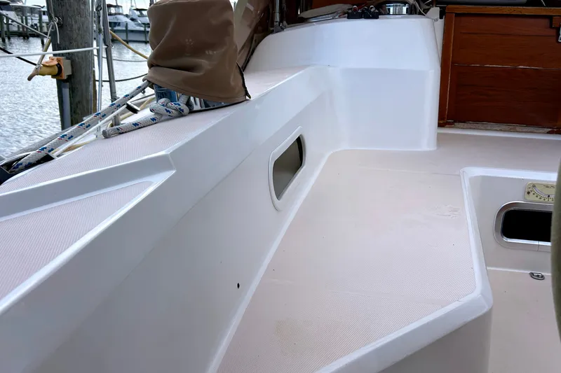 Slide: The Image of Cockpit view of a 2001 Sabre 402 sailboat, showcasing seating and deck details. - 35