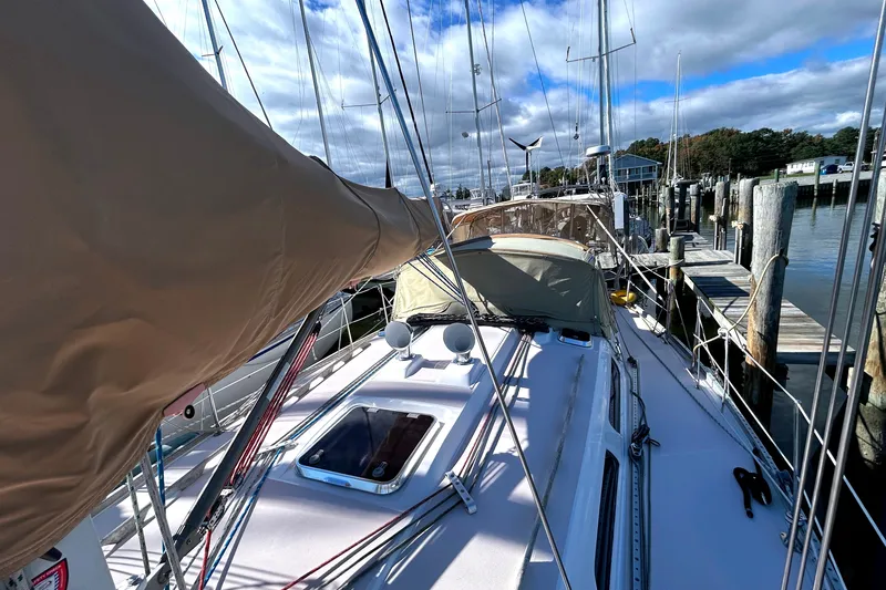 Slide: The Image of Sailboat docked at marina, Sabre 402, 2001 model, with clear skies and calm waters. - 39