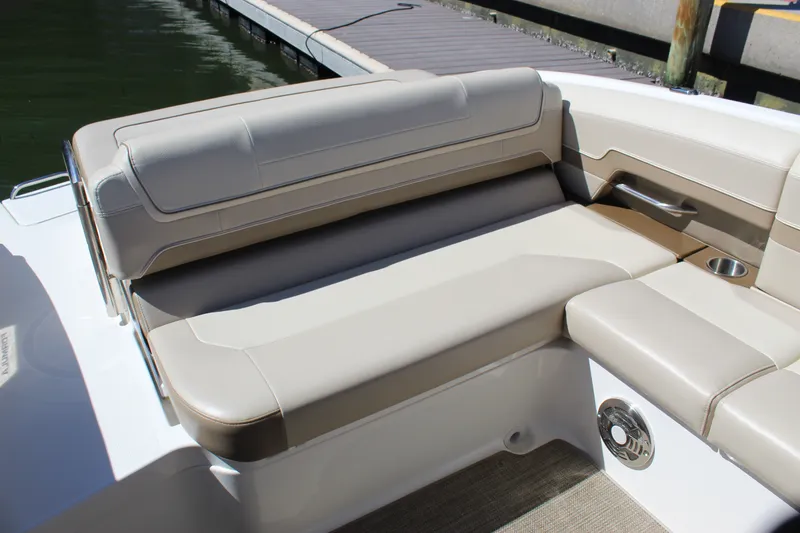 Slide: The Image of 2015 Formula 270 Bowrider boat interior with beige seating and cup holder. - 35