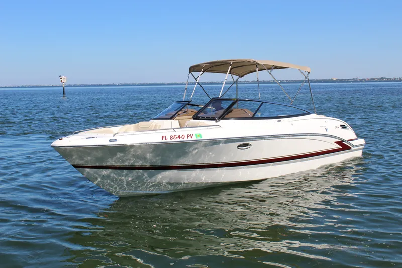 The Image of 2015 Formula 270 Bowrider boat cruising on calm waters under clear blue skies. - 0