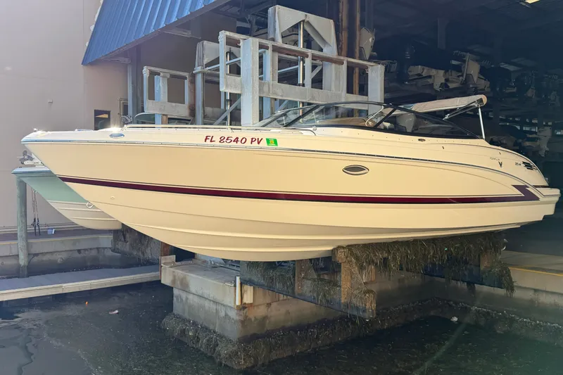 Slide: The Image of 2015 Formula 270 Bowrider boat on lift in marina storage. - 14