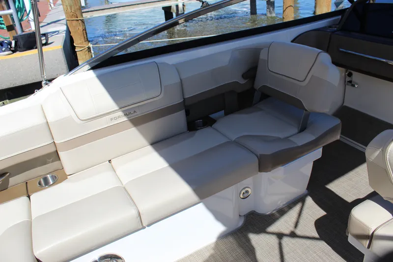 Slide: The Image of 2015 Formula 270 Bowrider interior with beige seating and cup holders. - 30
