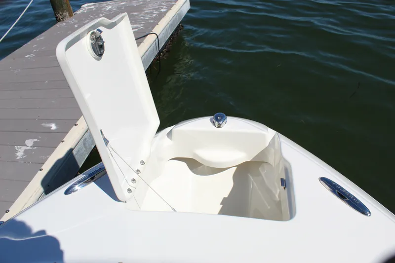 Slide: The Image of 2015 Formula 270 Bowrider boat with open storage compartment at dockside. - 41