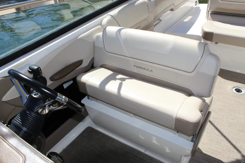 Slide: The Image of 2015 Formula 270 Bowrider interior with beige seating and steering wheel. - 33