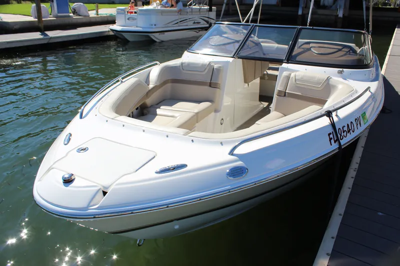 Slide: The Image of 2015 Formula 270 Bowrider boat docked in sunny marina setting. - 18