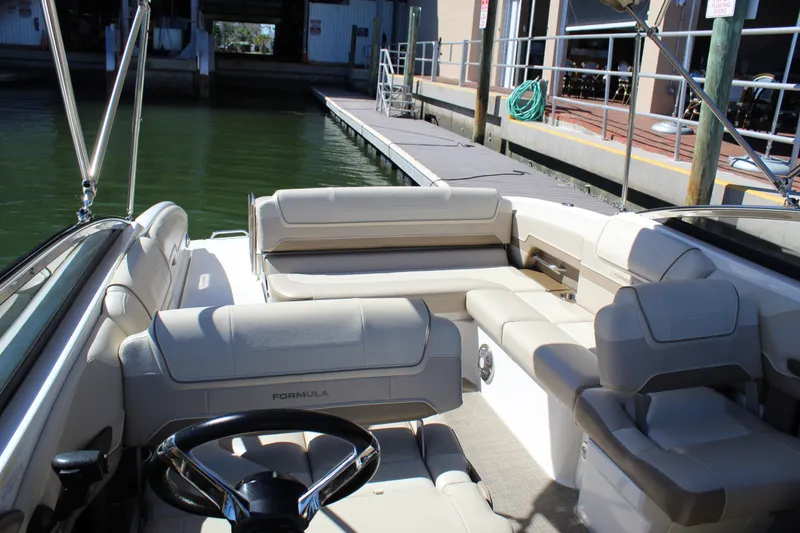 Slide: The Image of 2015 Formula 270 Bowrider interior with beige seating, docked at marina. - 31