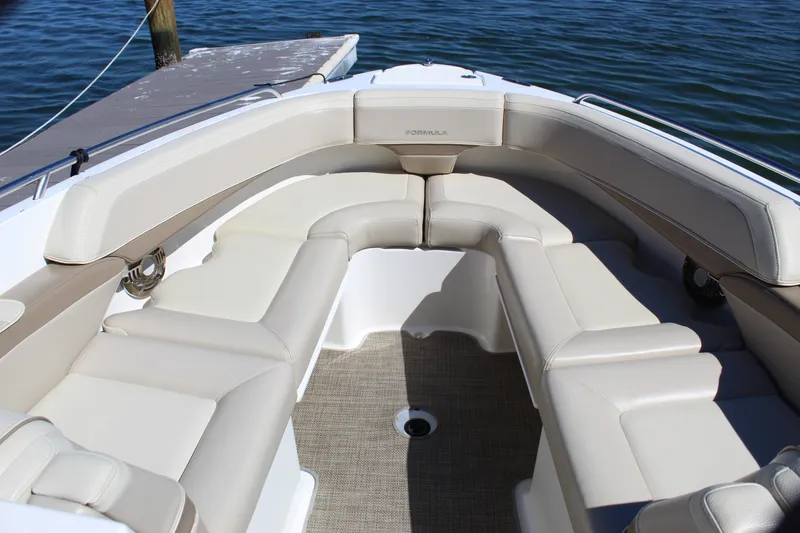 Slide: The Image of 2015 Formula 270 Bowrider boat with spacious beige seating and elegant design. - 39