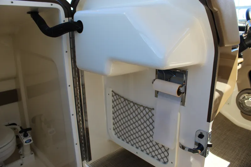 Slide: The Image of Interior of 2015 Formula 270 Bowrider boat showing toilet and storage area. - 44