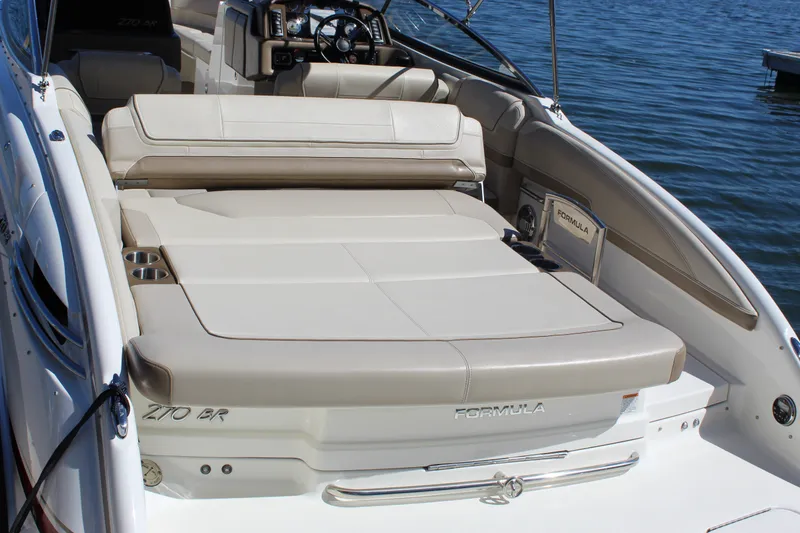 Slide: The Image of 2015 Formula 270 Bowrider boat with spacious seating and sleek design on the water. - 37