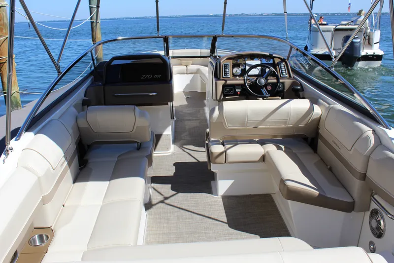 Slide: The Image of 2015 Formula 270 Bowrider interior with luxurious seating and modern dashboard on the water. - 23