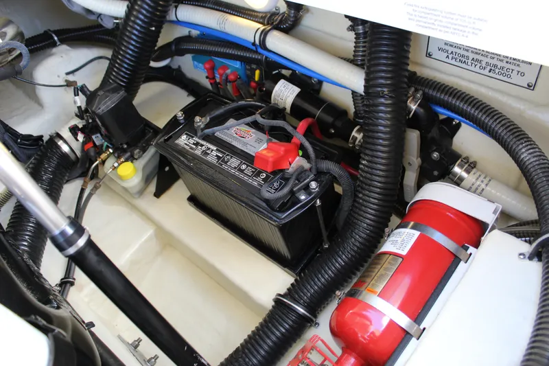 Slide: The Image of Engine compartment of a 2015 Formula 270 Bowrider with battery and fire extinguisher. - 48