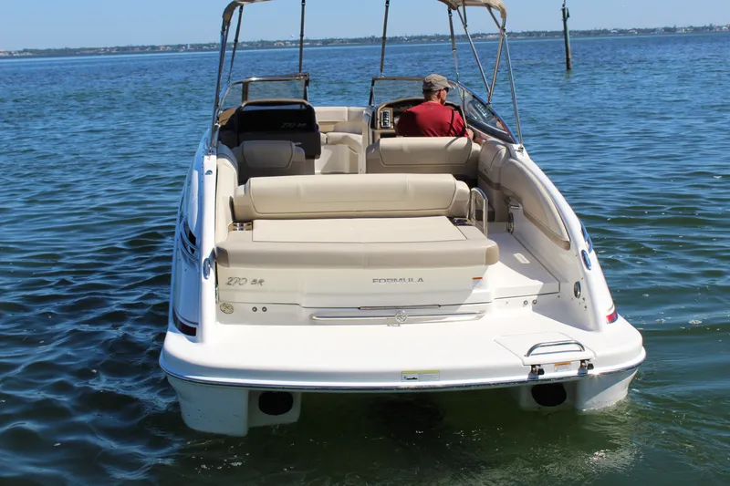 Slide: The Image of 2015 Formula 270 Bowrider boat on water, rear view with driver seated. - 6