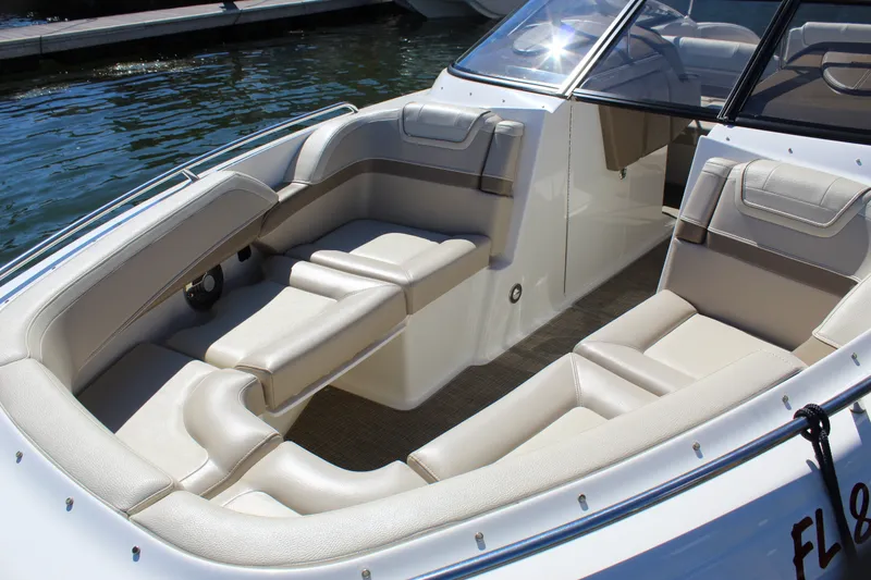 Slide: The Image of 2015 Formula 270 Bowrider boat interior with beige seating and sleek design. - 17
