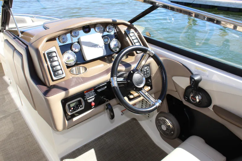 Slide: The Image of Cockpit of 2015 Formula 270 Bowrider with steering wheel and control panel. - 28