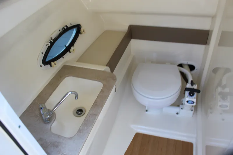 Slide: The Image of 2015 Formula 270 Bowrider boat bathroom with sink and toilet. - 42