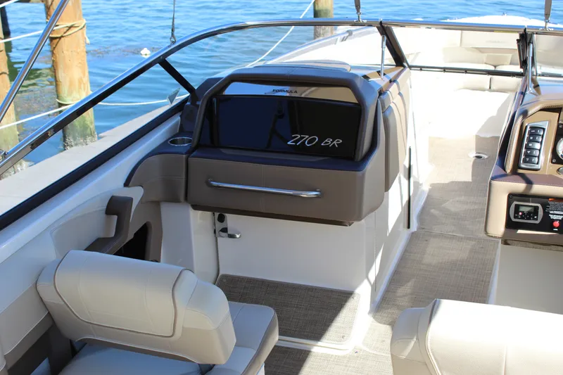 Slide: The Image of 2015 Formula 270 Bowrider interior with helm, seating, and dashboard controls. - 29