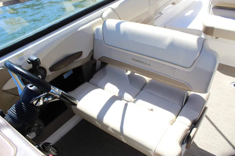 Slide: The Image of 2015 Formula 270 Bowrider interior with steering wheel and comfortable seating. - 32