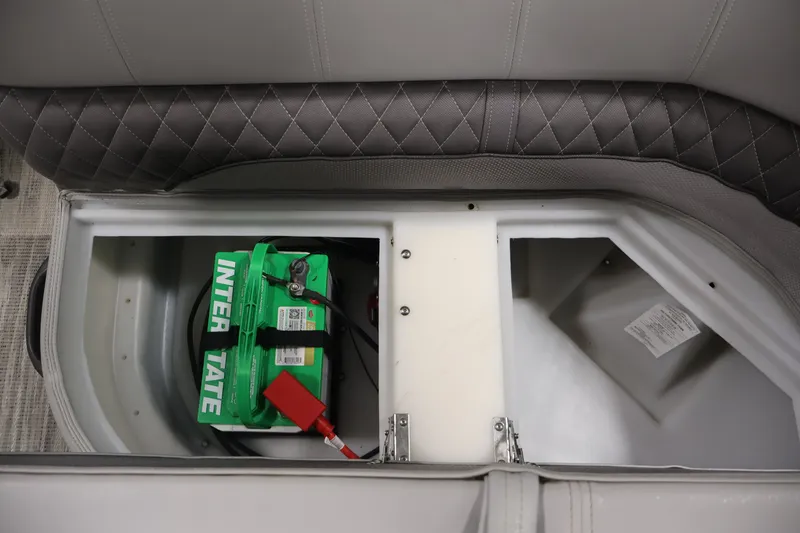 Slide: The Image of Battery compartment of 2025 Ranger Reata 220C boat with Interstate battery. - 33