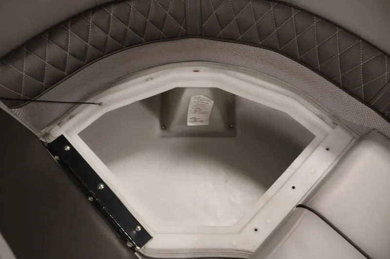 Slide: The Image of Interior storage compartment of 2025 Ranger Reata 220C boat with quilted upholstery. - 16