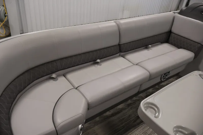 Slide: The Image of 2025 Ranger Reata 220C boat interior with plush seating and modern design. - 15