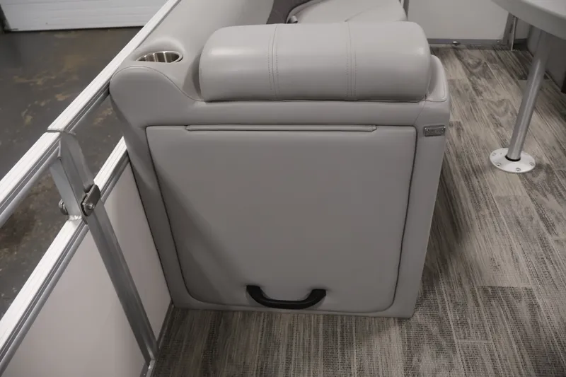 Slide: The Image of 2025 Ranger Reata 220C boat interior with gray seating and cup holder. - 19