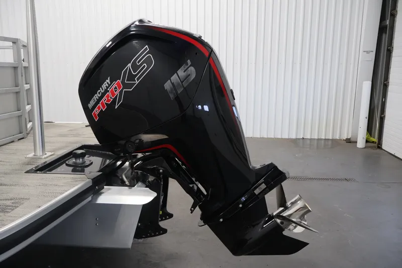 Slide: The Image of Mercury Pro XS 115 outboard motor on 2025 Ranger Reata 220C boat in a garage. - 38