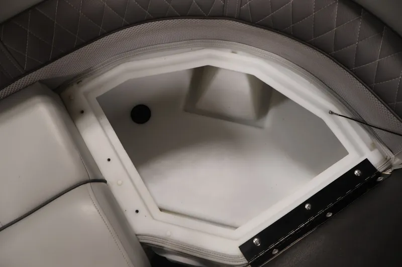 Slide: The Image of Interior storage compartment of 2025 Ranger Reata 220C boat with quilted upholstery. - 14