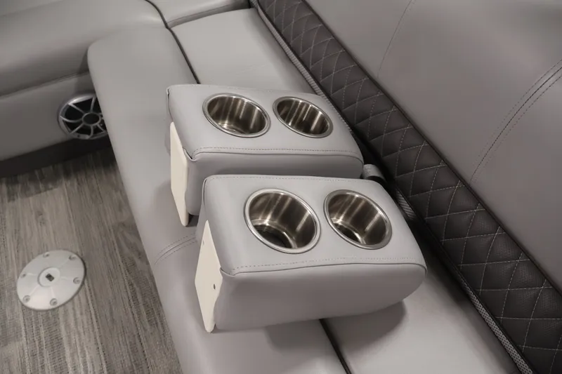 Slide: The Image of 2025 Ranger Reata 220C interior with dual cup holders and quilted upholstery. - 34