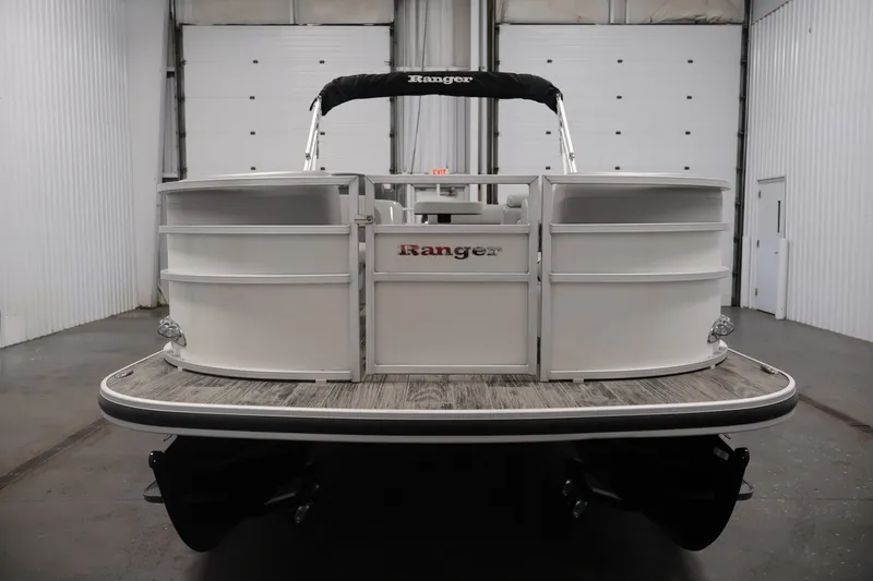 Slide: The Image of 2025 Ranger Reata 220C pontoon boat in a spacious indoor setting. - 3