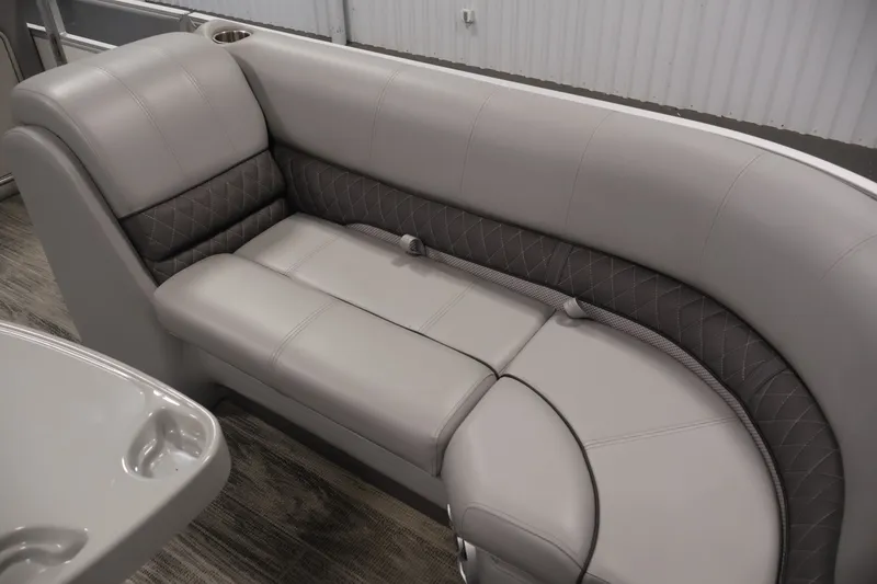 Slide: The Image of Luxurious seating in the 2025 Ranger Reata 220C boat, featuring elegant gray upholstery. - 12