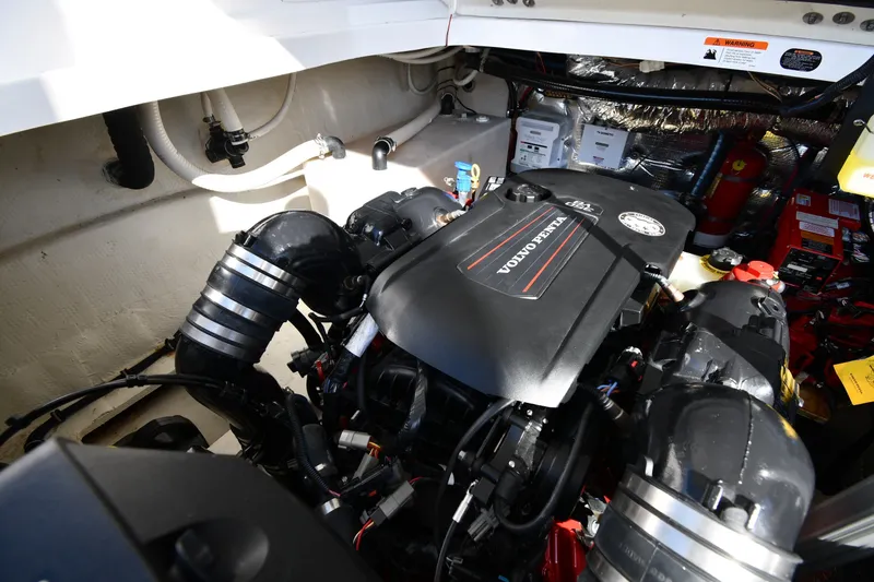Slide: The Image of Engine compartment of a 2021 Regal 35 Sport Coupe featuring a Volvo Penta engine. - 52