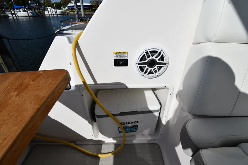 Slide: The Image of Interior of 2021 Regal 35 Sport Coupe with speaker, cooler, and seating area. - 22