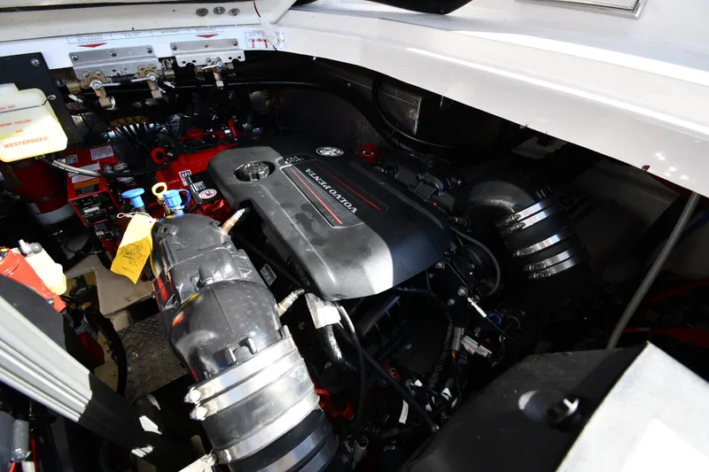Slide: The Image of Engine compartment of 2021 Regal 35 Sport Coupe boat, showcasing detailed mechanical components. - 51