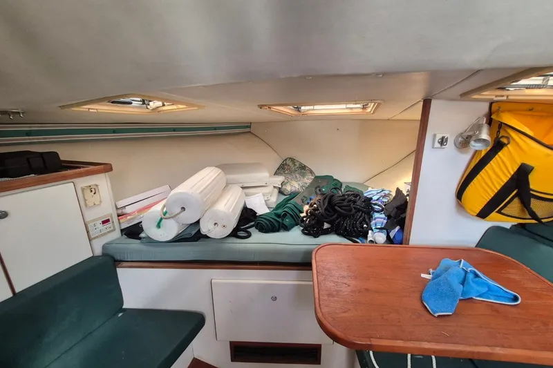 Slide: The Image of Interior of a 1996 Pursuit 3000 Offshore boat with equipment and supplies. - 38