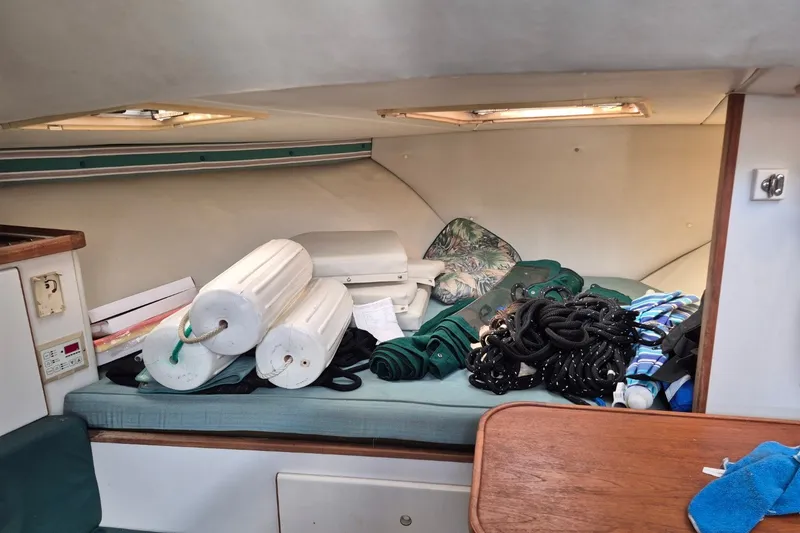 Slide: The Image of Interior of a 1996 Pursuit 3000 Offshore boat with marine equipment and supplies. - 39