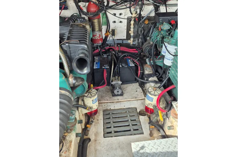 Slide: The Image of Engine compartment of a 1996 Pursuit 3000 Offshore boat, showing wiring and components. - 27