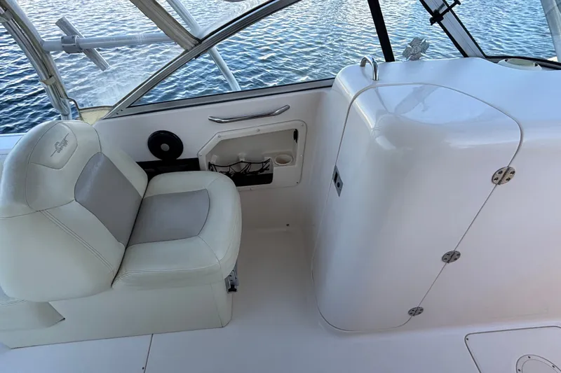 Slide: The Image of Interior of a 2008 Grady-White Freedom 275 boat with seating and storage. - 16