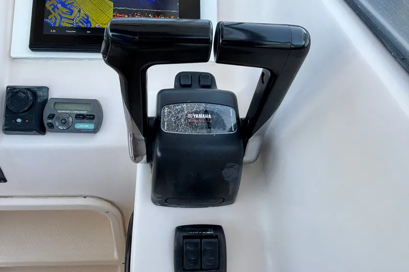 Slide: The Image of Control panel of a 2008 Grady-White Freedom 275 boat with Yamaha throttle. - 12