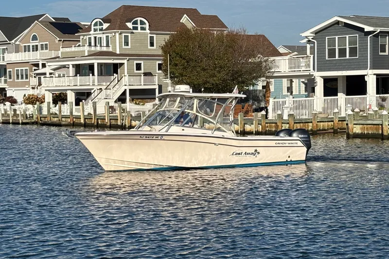 Slide: The Image of Grady-White Freedom 275 boat cruising near waterfront homes, 2008 model. - 1