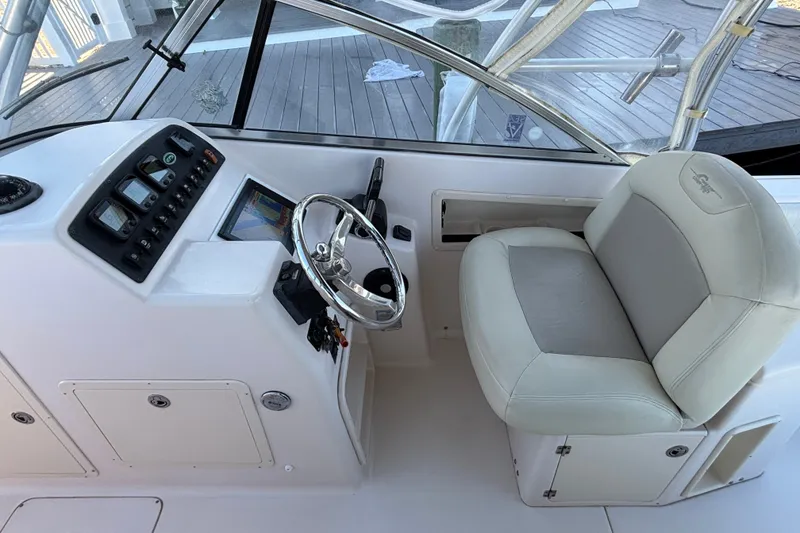 Slide: The Image of Grady-White Freedom 275 boat cockpit with steering wheel and control panel, 2008 model. - 13
