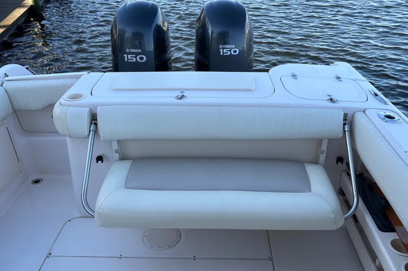 Slide: The Image of Grady-White Freedom 275 boat with Yamaha 150 engines, featuring a foldable rear seat. - 23