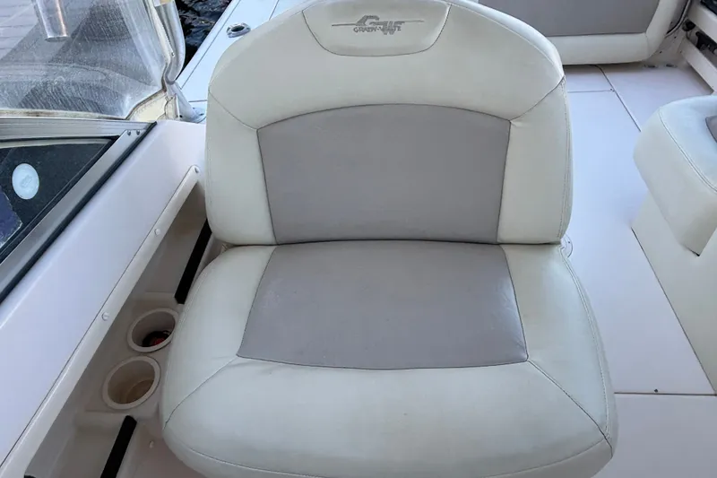 Slide: The Image of Grady-White Freedom 275 boat seat, 2008 model, featuring white and gray upholstery. - 15