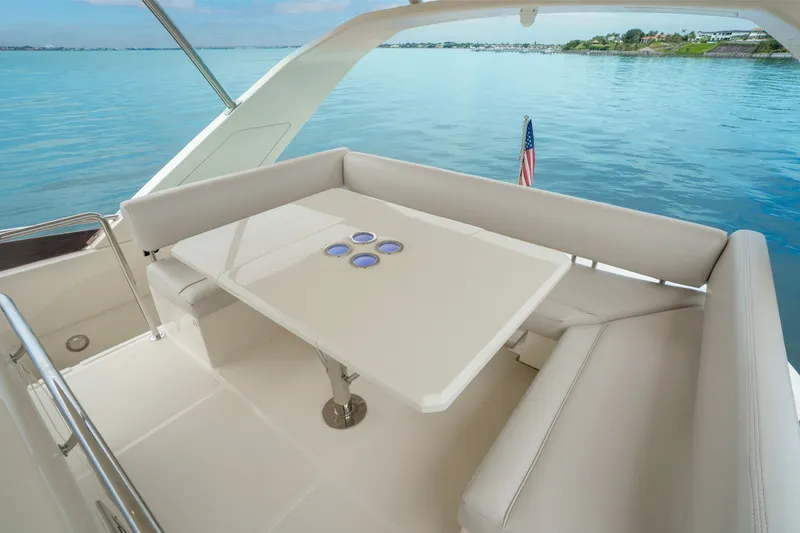 Slide: The Image of Luxurious seating area on 2018 Aquila 44 Yacht with scenic water view. - 38