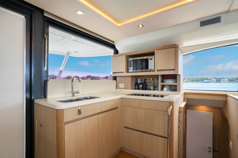 Slide: The Image of Luxurious kitchen interior of 2018 Aquila 44 Yacht with modern amenities and scenic view. - 22