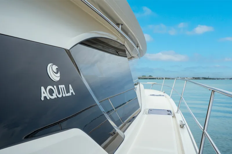 Slide: The Image of 2018 Aquila 44 Yacht on calm waters under a clear blue sky. - 34