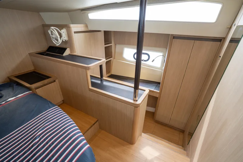 Slide: The Image of Interior of 2018 Aquila 44 Yacht with modern wood finish and natural light. - 26
