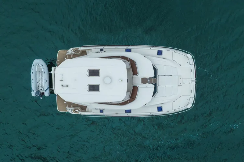 Slide: The Image of Aerial view of 2018 Aquila 44 Yacht on turquoise water. - 39